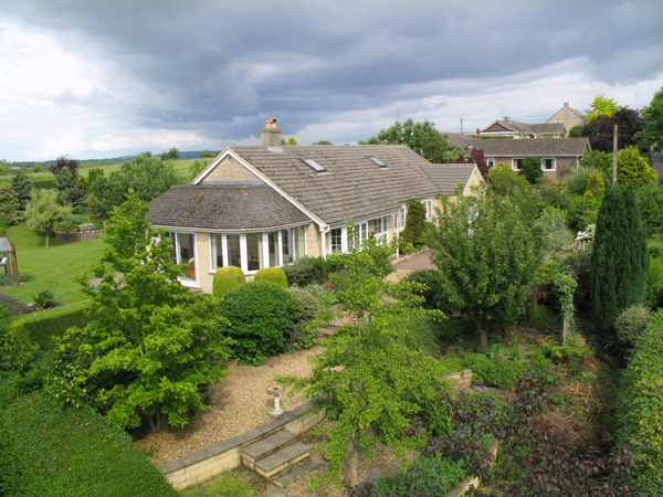 Mast Photography - bungalow with clouds